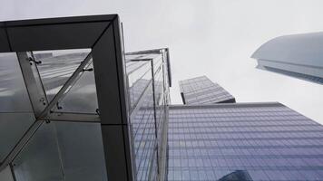 Modern Architecture Viewed from Below in an Urban Cityscape Setting with Dynamic Elements. Action video