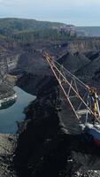 Captivating Aerial View of Extensive Mining Operations Taking Place in a Coal Extraction Site. Stock Clip video