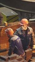 Workers on an Industrial Site Engaged in Various Heavy Machinery Operations and Tasks. Stock Clip video