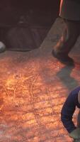 Workers who are engaged in handling molten material in an industrial foundry setting. Stock Clip video
