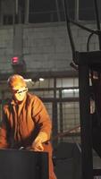 Industrial Worker in a Factory Setting Engaged in Various Tasks and Responsibilities. Stock Clip video