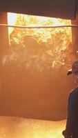 A Worker Operating a Furnace in a Metal Facility, skilled in alloys and automation for efficiency. Stock Clip video