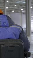 Warehouse Worker Skillfully Operating Various Types of Machinery in an Industrial Setting. Clip video