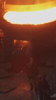The process of pouring molten metal in a factory can be a fascinating and skillful undertaking video