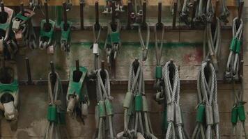 Industrial Cables and Hooks Organized on Workshop Wall video