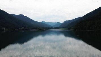 Symmetrical Reflection of Forested Mountains on Austrian Lake video