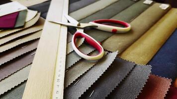 Ruler Scissors and Colorful Fabric Palette Examples in The Tailor Shop video
