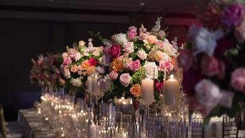 Elegant Table Setup with Colorful Flowers and Lit Candles for a Formal Event video