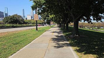 A bike ride on a bike path in downtown Chicago. First person POV view of the city and the highway. video