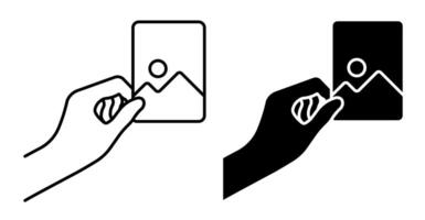 Linear icon. Hand holds paper photograph. Memories of vacation or trip to nature. Printing photos. Simple black and white isolated on white background vector