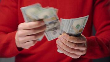 Man counting US Dollar bills, close-up video