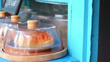 A Truly Delicious Pastry Displayed Under Glass at a Charming Bakery video