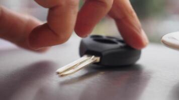 A CloseUp of a Car Key Positioned on a Table with a Blurred Background video