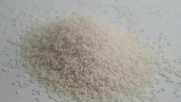 A CloseUp Image Showing White Rice Grains Neatly Arranged in a Pile video