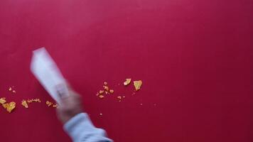 Removing Crumbs to Ensure a Clean and Tidy Red Table Surface video