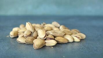 slow motion of pistachios nut dropping on black background video