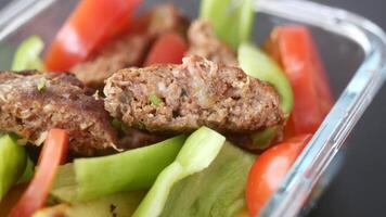A nutritious and colorful healthy meat and vegetable salad in a glass container video