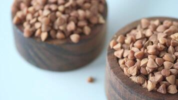 Close-Up View of Buckwheat Grains in Wooden Containers for Healthy Living video