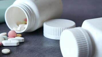 A Closeup View of Various Medications Stored in Pill Bottles for Use video