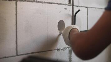 Creating a hole in a gas block wall for electrical wiring video
