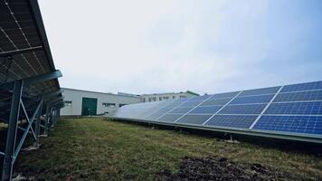 Innovative photovoltaic panels on the field. Sunny batteries on the ground in the modern solar farm. Renewable source of energy. video