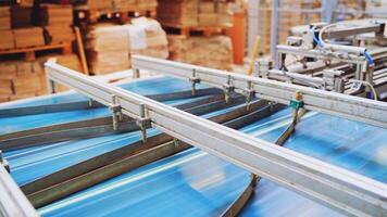 Robotic equipment on a factory. Metal construction of automated technologies inside the industrial plant. Conveyor line at working process. video