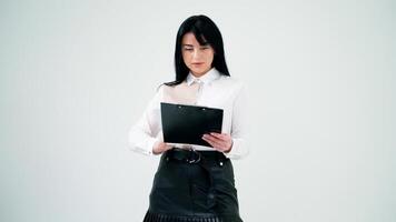 Pretty woman and a businessman on white background. Portrait of a beautiful business woman with a folder. Handsome man working on a tablet. video