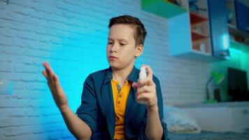 Hand sanitizer. Boy using hand sanitizer alcohol spray. Measures to prevent the spread of the covid-19 virus. video