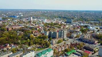 Panoramic view of a beautiful city. View from above on the urban buildings and green trees in summertime. Aerial view. video
