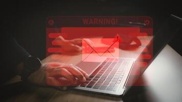 Hacker or programmer using laptop with triangle caution warning sign, coding, cryptography, hacker, crime, virus, for notification error and maintenance concept. Computer with red warning sign. photo