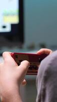 vertical Boy playing retro games at home using controller video