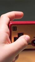 vertical Child playing with retro gamepad controller video