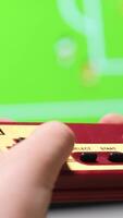 vertical Child playing retro games using controller and television video