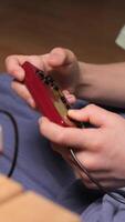 vertical Boy playing retro games using controller and console video