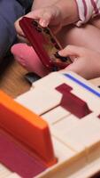 vertical Child playing with retro game console and controller video