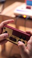 vertical Boy playing with retro game console and controller video