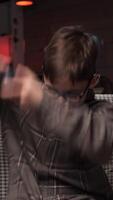 vertical Boy holds game console joystick and hits controller with his hands in anger video