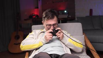 Man angry because he lost a game. man plays games with a gamepad video