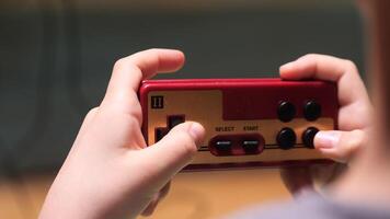 Child playing with retro gamepad controller video