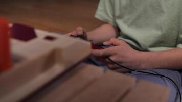 Boy playing retro games at home using controller video