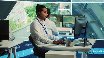 Indian call center operator gathers location and gps coordinates, monitoring traffic via surveillance camera system. Employee using CCTV real time footage to collect data. Camera A. photo