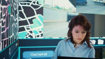 Supervisor following delivery truck route on the satellite map, using gps coordinates and navigation in control center headquarters. Manager overseeing order tracking and shipment. Camera B. photo