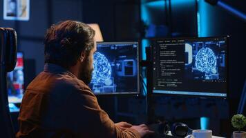 Developer updating artificial intelligence neural networks, typing on computer keyboard in neon lit personal office. Freelancing IT specialist writing AI code, training machine learning, camera A photo