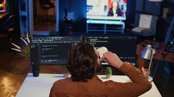 Admin using javascript coding language to fortify security and safeguard consumer data, remotely working for IT company. Software developer upgrading binary code scripts on computer terminal, camera B photo