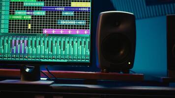 Professional studio control room with pre amp knobs and faders, key buttons on recording desk, soundproof space. Audio mixer and regulator used to produce music, technical equipment. photo