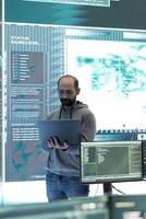 Cyber security team conducting cyber surveillance in a governmental control room. Experts group hacking activities, malware protection and data breach prevention in high tech agency. photo