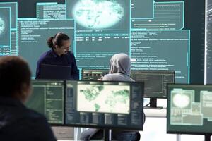 Governmental hackers team working on digital security and cyber defense measures, using pc and big screen. Experts focusing on cyber operations, network security and server protection. photo