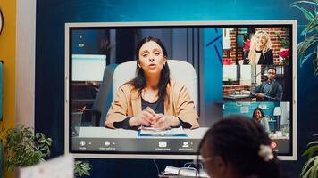 Business partners collaborating on global development project via videocall, discussing about different ways of increasing profit. Associates making strategies to improve corporate culture. Camera A. photo
