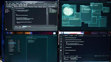 Code running on monitors in empty apartment used by hacker stealing state secrets from another countries. Malicious scripts on PC screens used by spy infiltrating governments photo