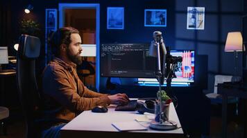 Programmer developing code on computer screen while in personal office using java programming languages. IT admin working with software tool, fixing database errors while working from home, camera B photo